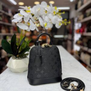 lv alma handbag and backpack